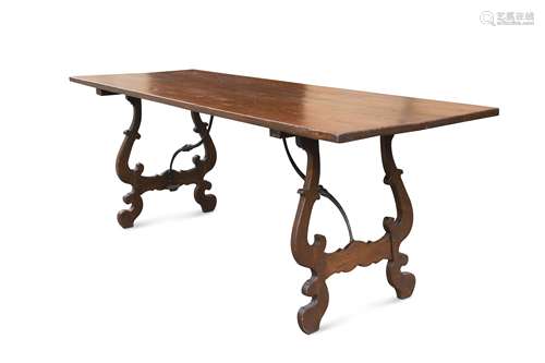 An Italian trestle dining table with wrought iron supports,