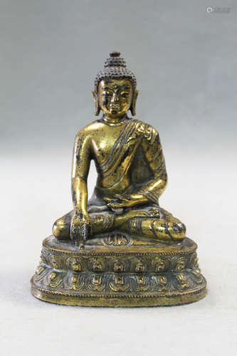 A 19th century Tibetan gilt bronze model of Buddha,