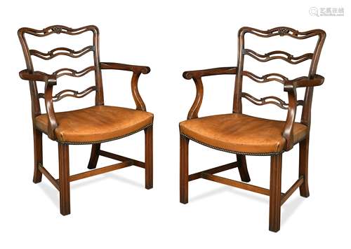 A pair of Chippendale style mahogany elbow chairs, late 19th century,