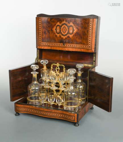 A 19th century inlaid table top liquor cabinet with key,