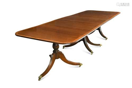 A mahogany three pedestal dining table in the Regency style, 20th Century,