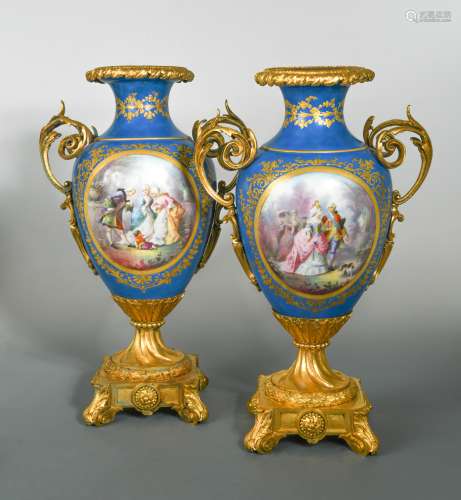 A pair of French porcelain, two-handled ormolu mounted vases, probably Sevres,