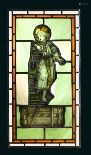 An 18th century stained glass panel of a young boy with halo,