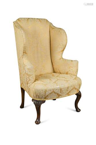 A Queen Anne style wing armchair, late 19th century,