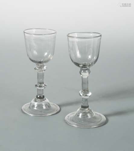 A pair of George III wine glasses,
