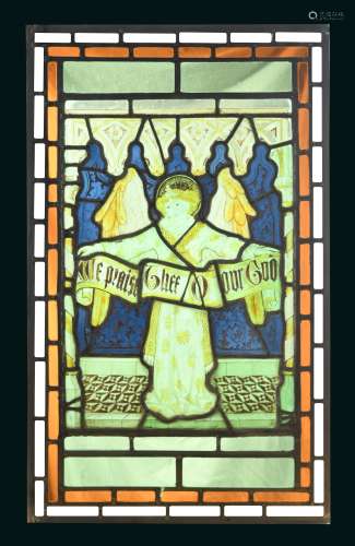 A 19th century stained glass panel of an angel holding a banner 'We praise Thee O our God',