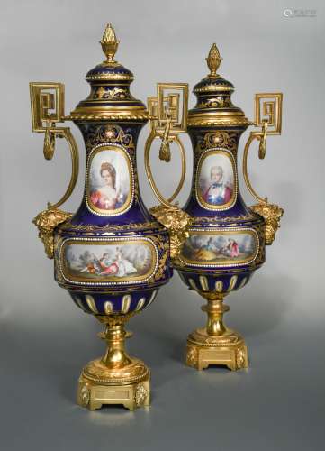 An impressive pair of French porcelain, two-handled ormolu vases and covers, probably Sevres,