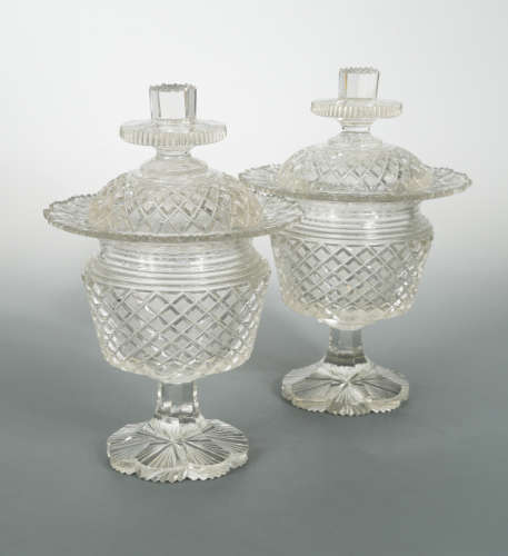 A pair of 19th century Irish cut glass pedestal vases and covers,