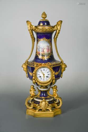 A 19th century French porcelain and ormolu mounted vase-shape clock and cover, probably Sevres,