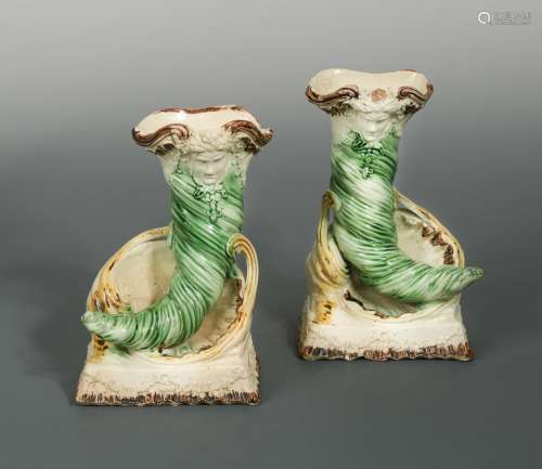 A rare pair of 18th century Staffordshire cornucopia vases,