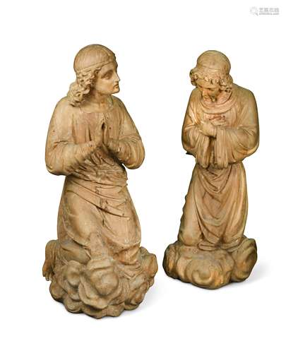 An imposing pair of carved kneeling female figures, possibly limewood and early 18th century,