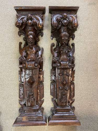 A near pair of oak carved herms, probably 17th century,