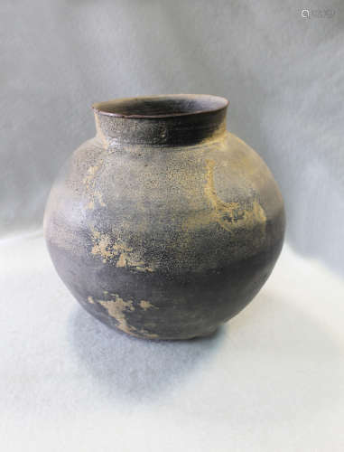 A Chinese ash glazed pottery jar, perhaps Han Dynasty (206 BC-220 AD),
