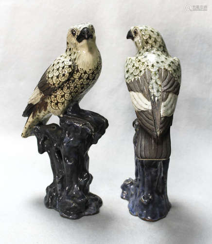 A pair of Chinese Shiwan pottery models of hawks,