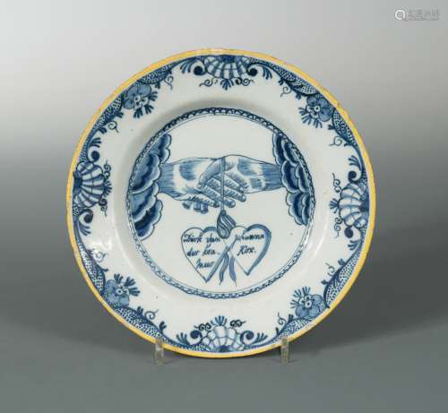 An 18th century Delft blue and white marriage plate,