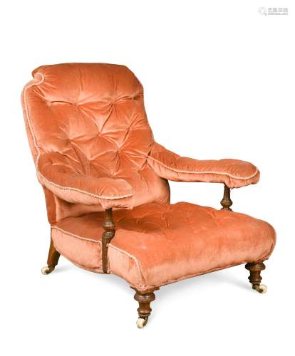 A late-Victorian walnut lounging chair in the manner of Shoolbred,