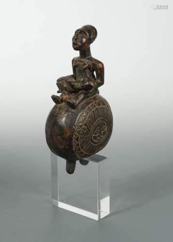 A Yombe (or Mayombe) carved wood “Dibu”, figural bell,