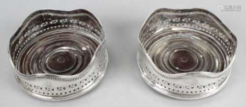 A pair of George III Irish silver mounted wine coasters,