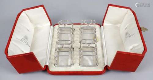 A cased set of four small George V silver toast racks,
