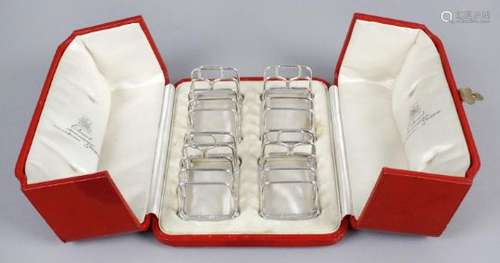 A cased set of four small George V silver toast racks,