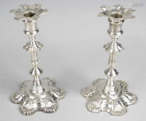 A pair of George II cast silver candlesticks by John Cafe,