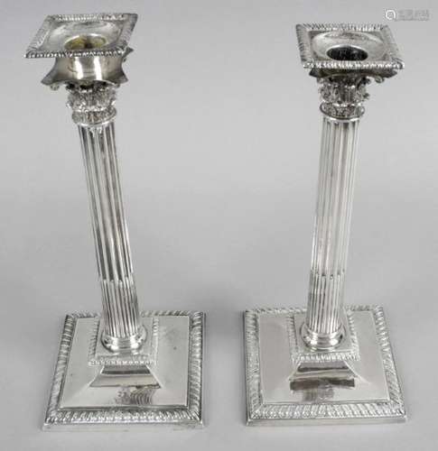 A pair of Irish cast silver candlesticks,