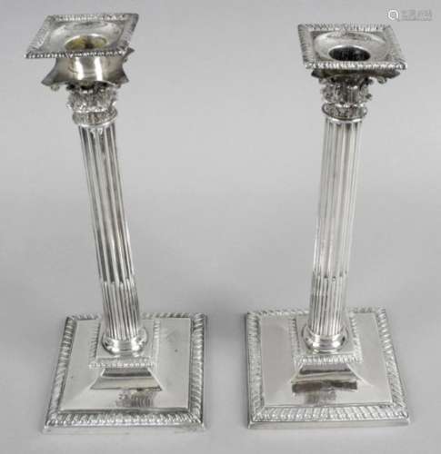 A pair of Irish cast silver candlesticks,