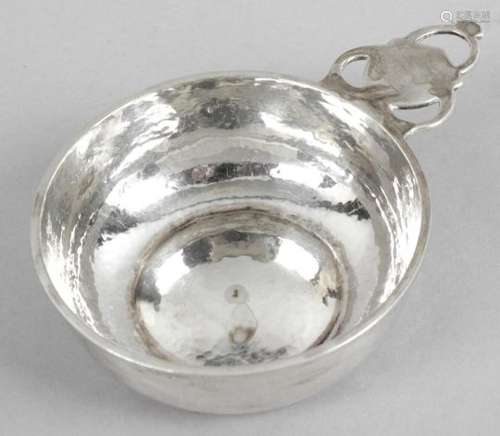 A 1920's planished silver wine taster by Albert Edward Jones,