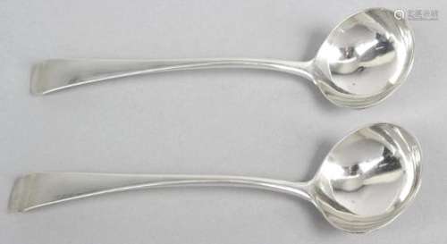 A pair of provincial silver toddy ladles, in Old English pattern with plain circular bowls.