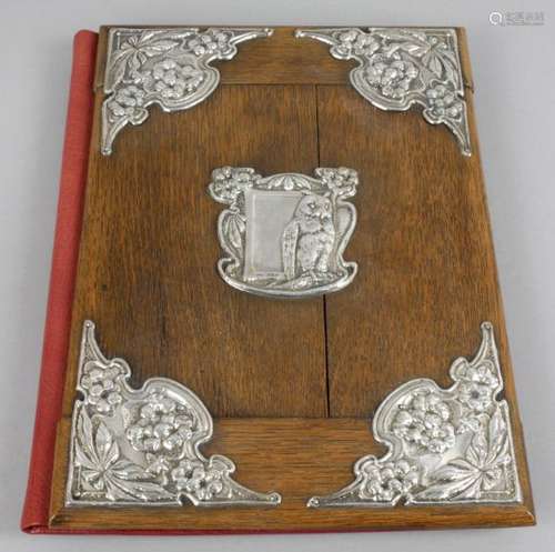 An Edwardian silver mounted oak and leather blotter of rectangular form,