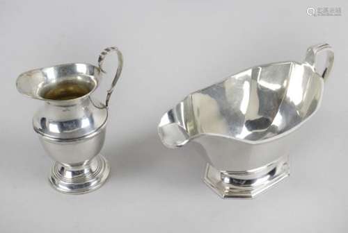 An early George V silver cream jug,