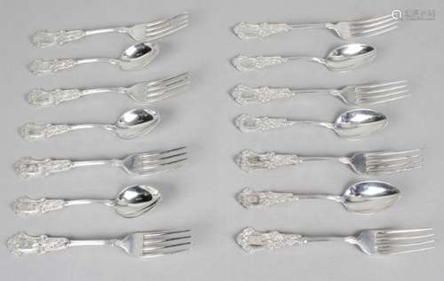 A set of six sterling silver teaspoons and nine matching dessert forks,