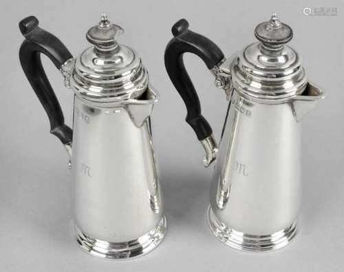 A pair of George V silver hot water or milk pots,