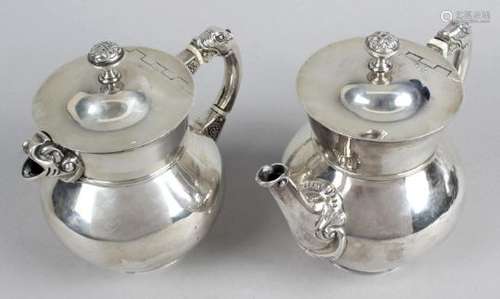 An Irish silver Arts & Crafts style teapot and similar hot water pot,