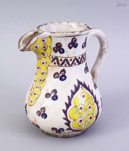 A RARE 18TH CENTURY TURKISH KUTAHYA CINTEMANI DESIGN SMALL POTTERY JUG, 14.5cm high.