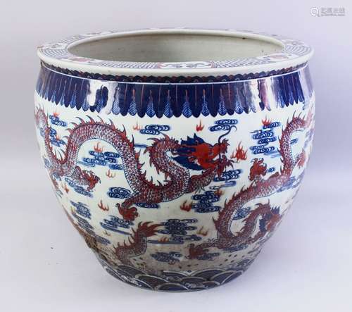 A LARGE 19TH / 20TH CENTURY CHINESE BLUE, WHITE & IRON RED PORCELAIN JARDINIERE, the body