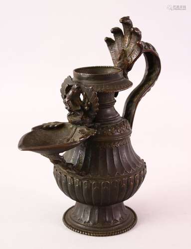 A FINE 17 / 18 CENTURY NEPALESE BRONZE OIL LAMP EWER, with a moulded hand on the handle, the spout