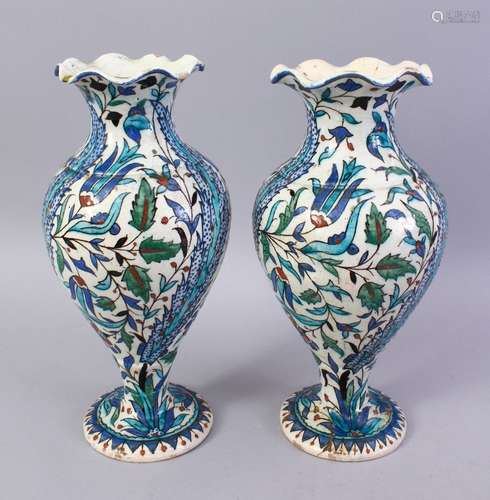 A PAIR OF 19TH CENTURY TURKISH OTTOMAN KUTAHIYA BALUSTER SHAPE VASES, painted in the Iznik style,