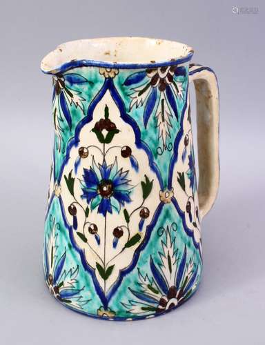 A TURKISH KUTAHIYA POTTERY JUG, painted in the Iznik style, 20cm high.