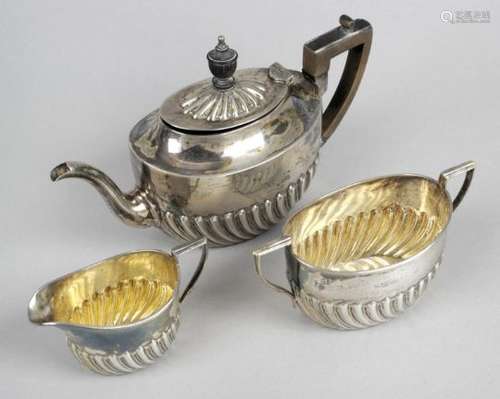 A late Victorian silver three piece bachelor tea set,