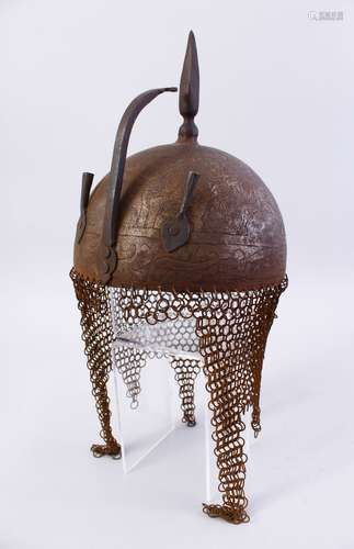 AN EARLY 20TH CENTURY PERSIAN QAJAR STEEL HELMET, with engraved decoration, 22cm high.