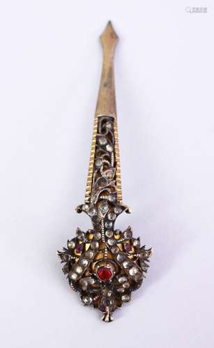 A GOOD 19TH CENTURY INDIAN TURBAN CLIP, with carved floral decoration and inset stones, 10cm