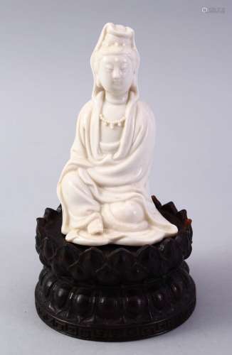 A GOOD CHINESE BLANC DE CHINE PORCELAIN FIGURE OF GUANYIN ON LOTUS BASE, the figure in a