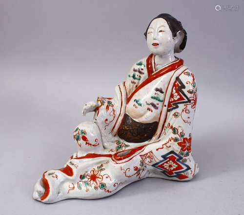 A GOOD JAPANESE EDO PERIOD IMARI PORCELAIN FIGURE OF A BEIJIN, in a seated position, 23cm high &