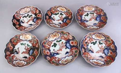 A SET OF SIX 17TH CENTURY JAPANESE IMARI PORCELAIN PLATES, each decorated with scenes of birds