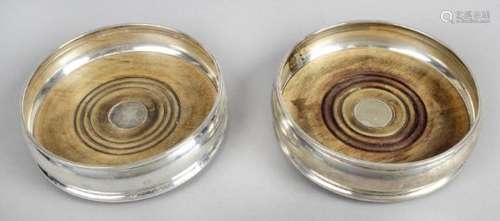 A pair of modern silver mounted wine bottle coasters,