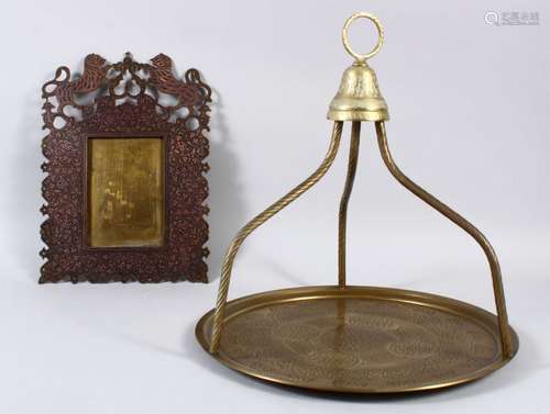 A 20TH CENTURY INDIAN MURADABAD BRASS FRAME , made for the English market, 31cm high x 22cm wide.