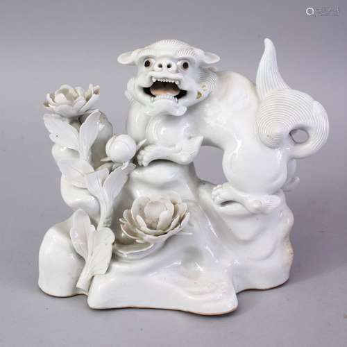 A JAPANESE MEIJI PERIOD HIRADO PORCELAIN SHI SHI DOG FIGURE, blanc de chine style, stood upon a