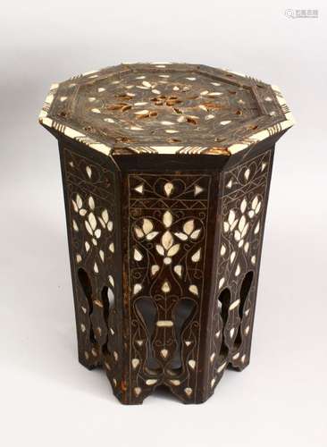 A 19TH CENTURY MOORISH CARVED HARDWOOD OCTAGONAL INLAID OCCASIONAL TABLE, inlaid with mother of