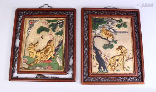 A PAIR OF CHINESE 19TH CENTURY CARVED & POLYCHROMED SOAPSTONE PANELS, carved with immortal figure